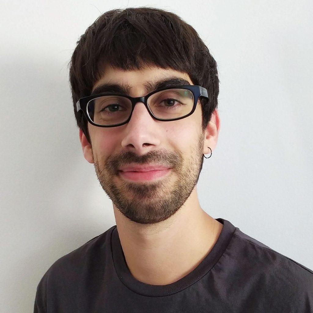 Spanish Male wearing glasses and smiling with beard